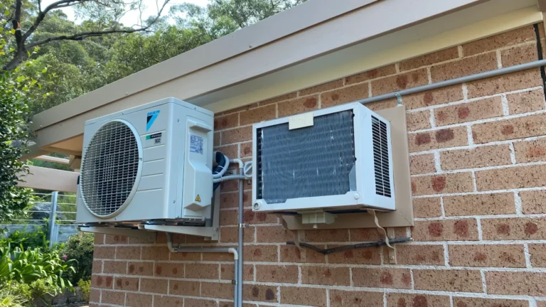 a new daikin split system next to an old system