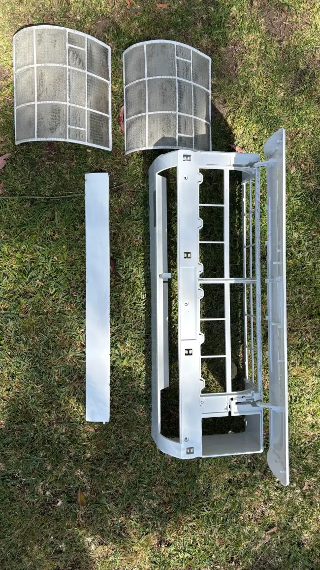 a split system pulled apart for cleaning